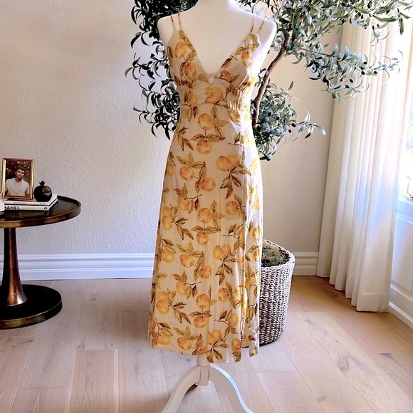 Urban Outfitters Dresses & Skirts - Urban Outfitters lemon print  dress with a side slit and adjustable straps.
